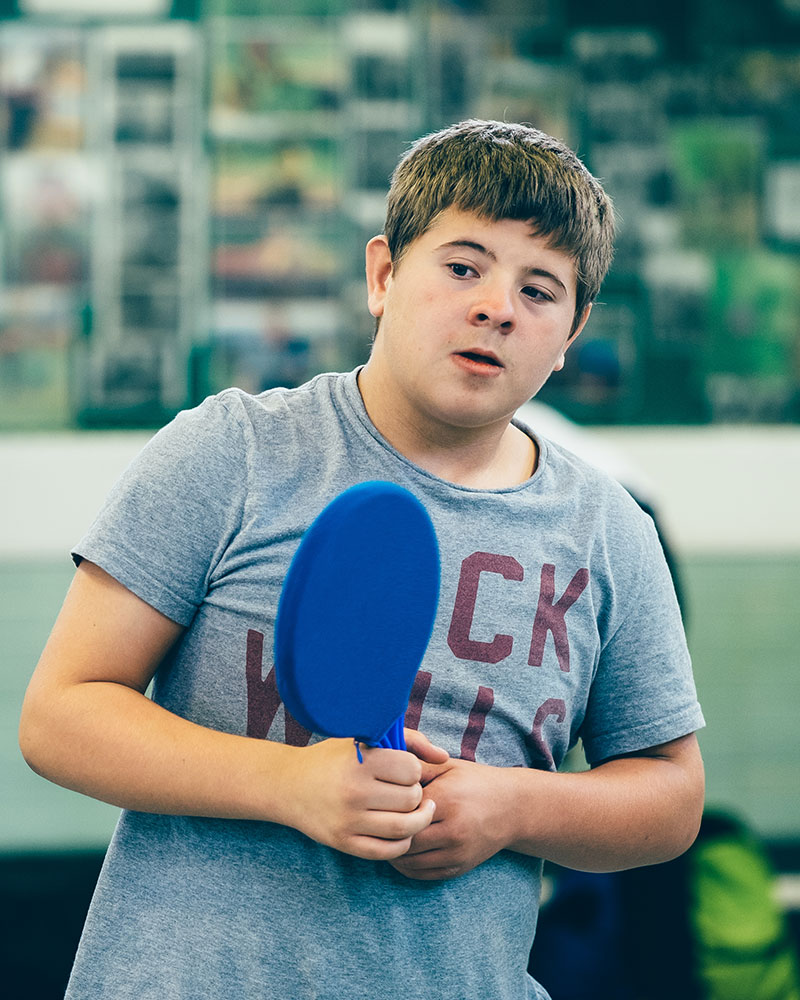 boy holding a racket