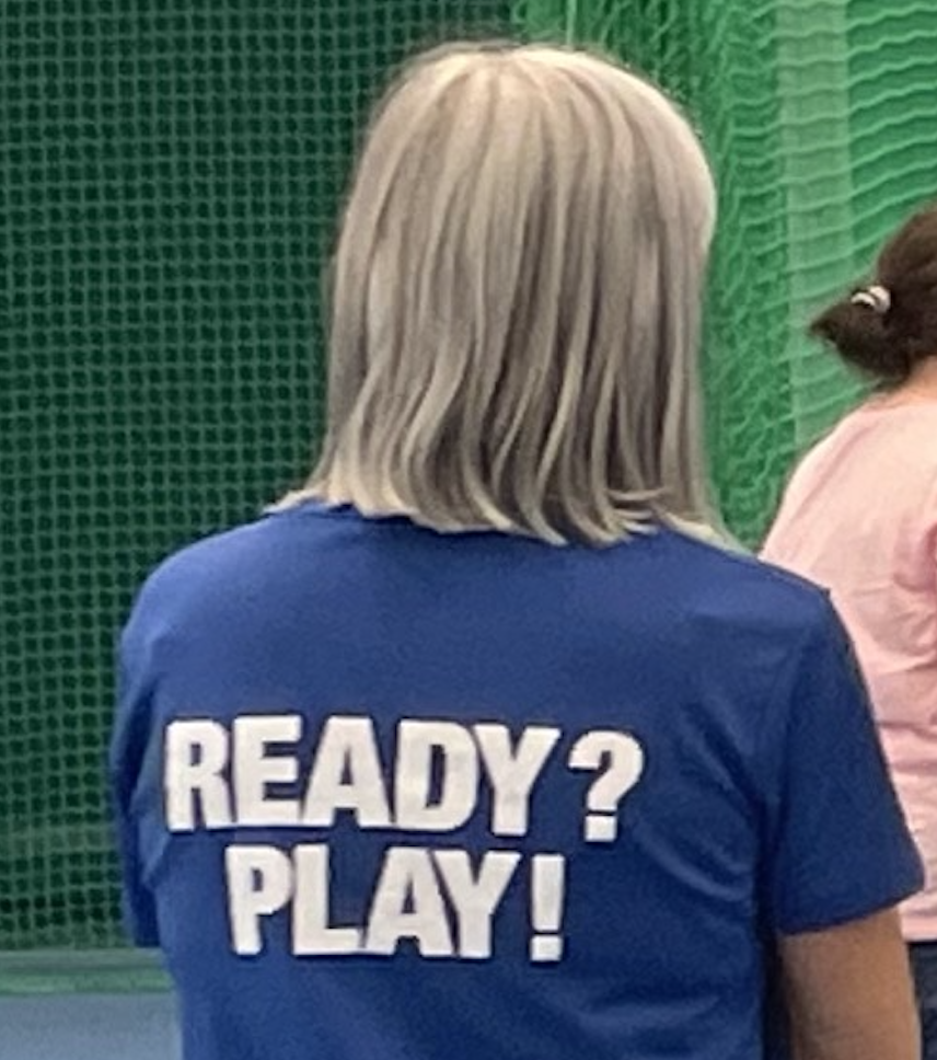 Back of someone's t-shirt with the words, Ready? Play!
