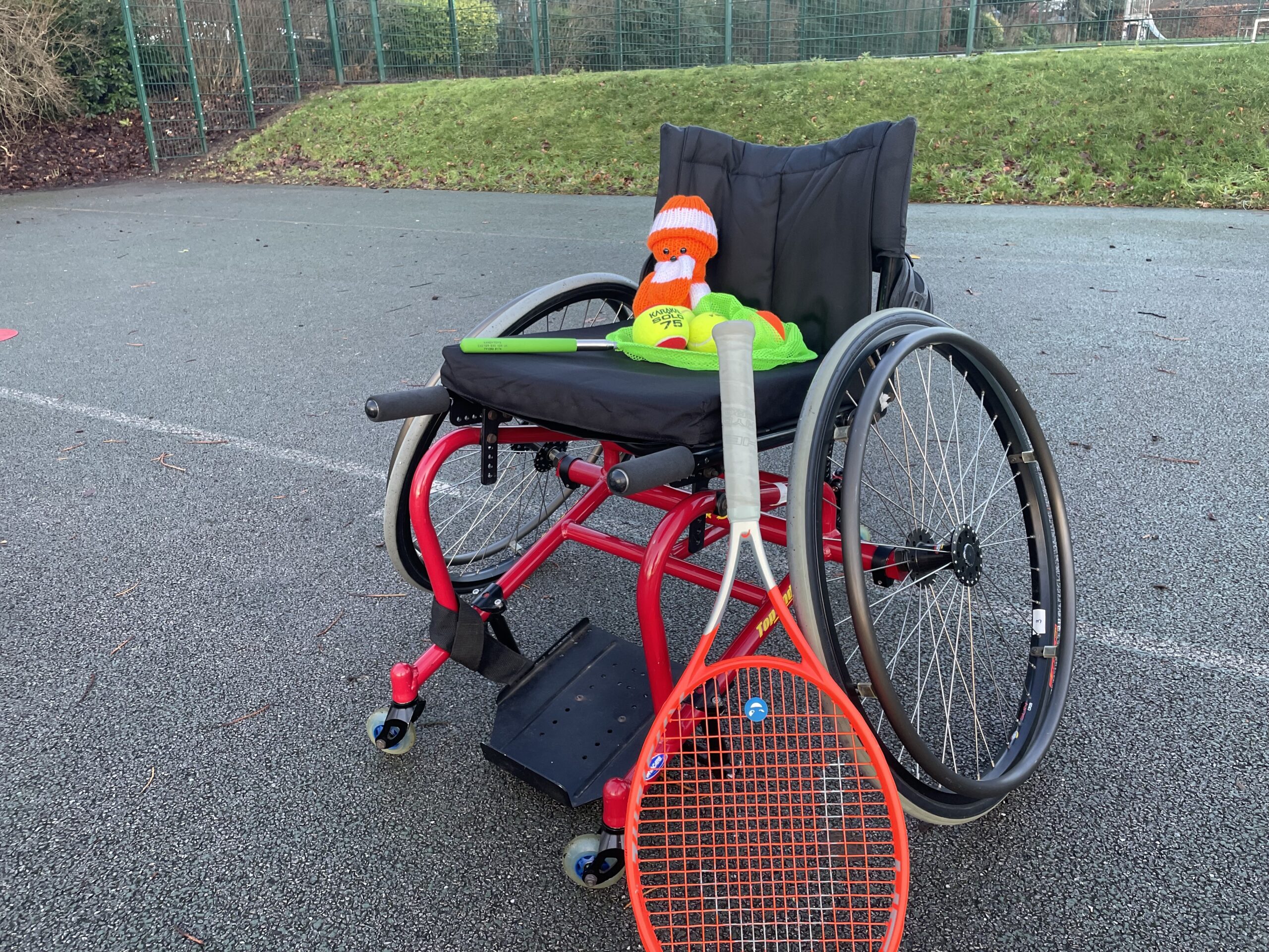 Tango sat on a sports wheelchair with LUSU equipment